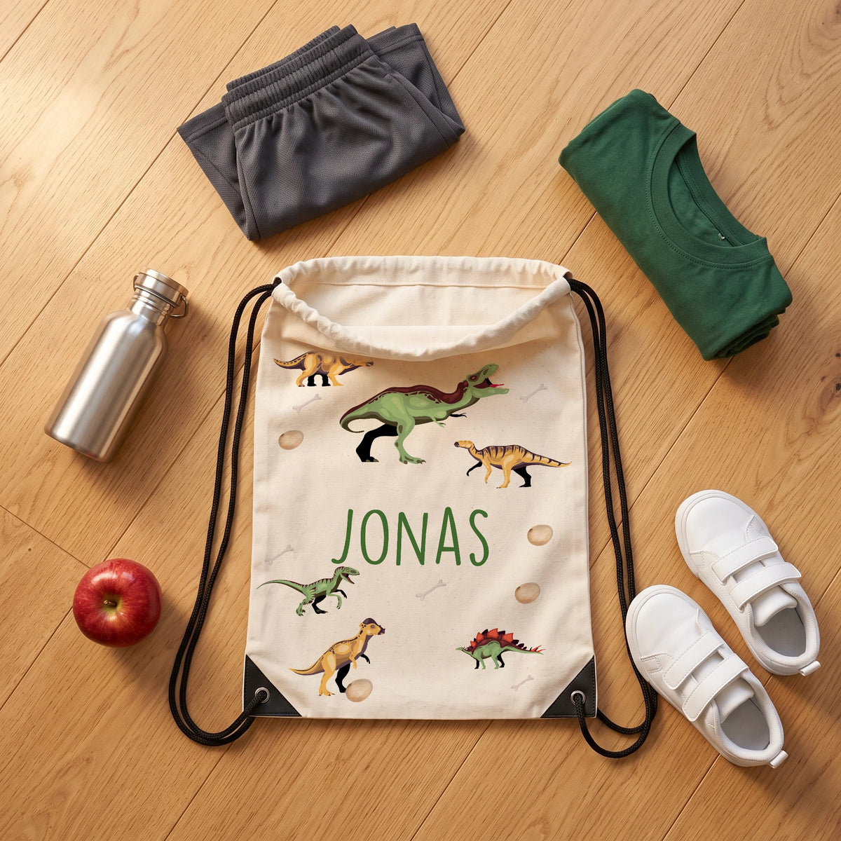 Sac de sport personnalisé avec tenue de sport, chaussures et gourde, motif dinosaures — Kidsmood